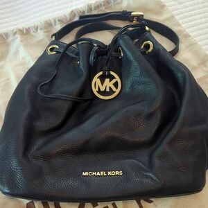 MICHAEL KORS black leather satchel bag with gold hardware.